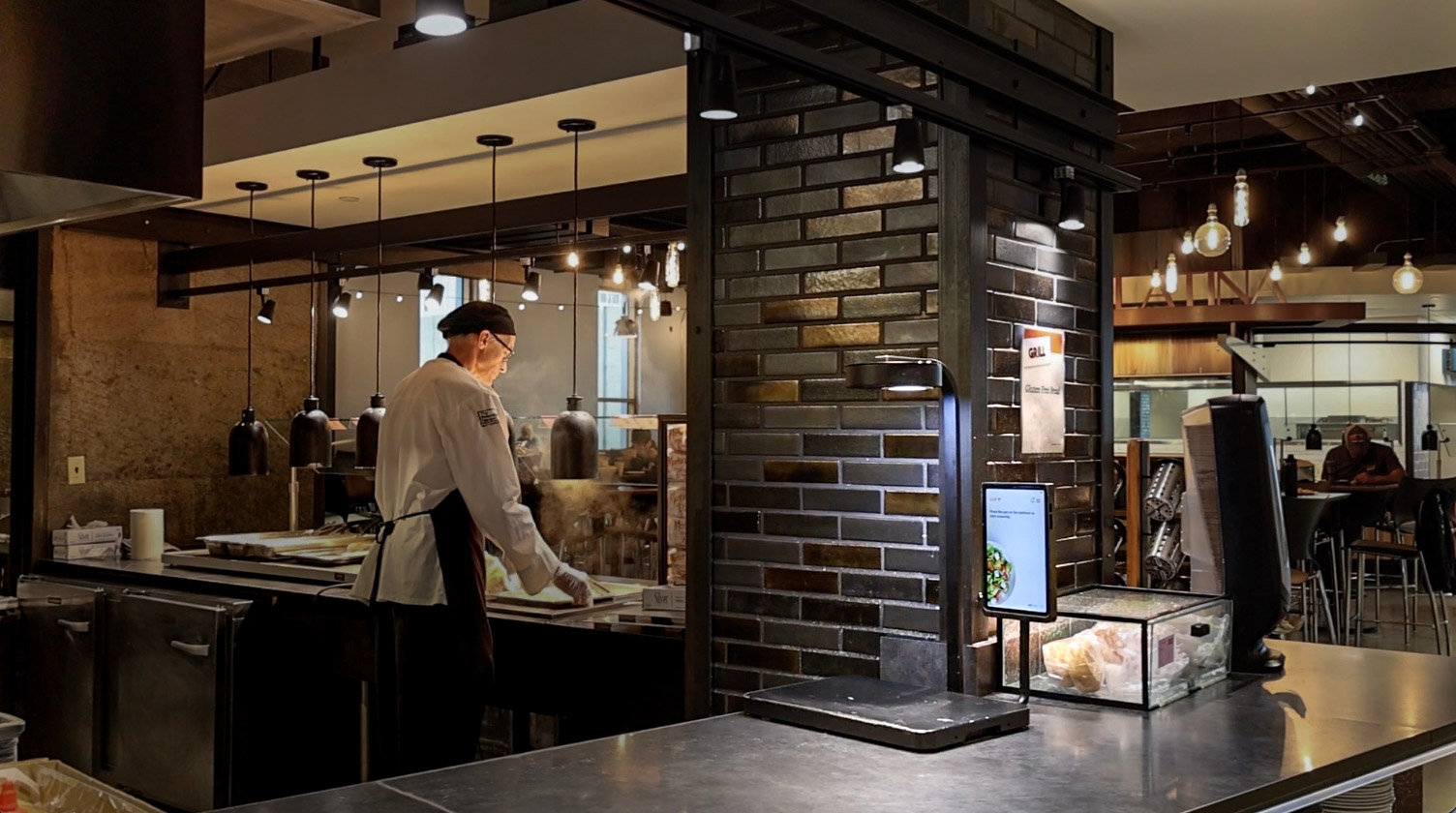 A chef at a service station with the Metafoodx device